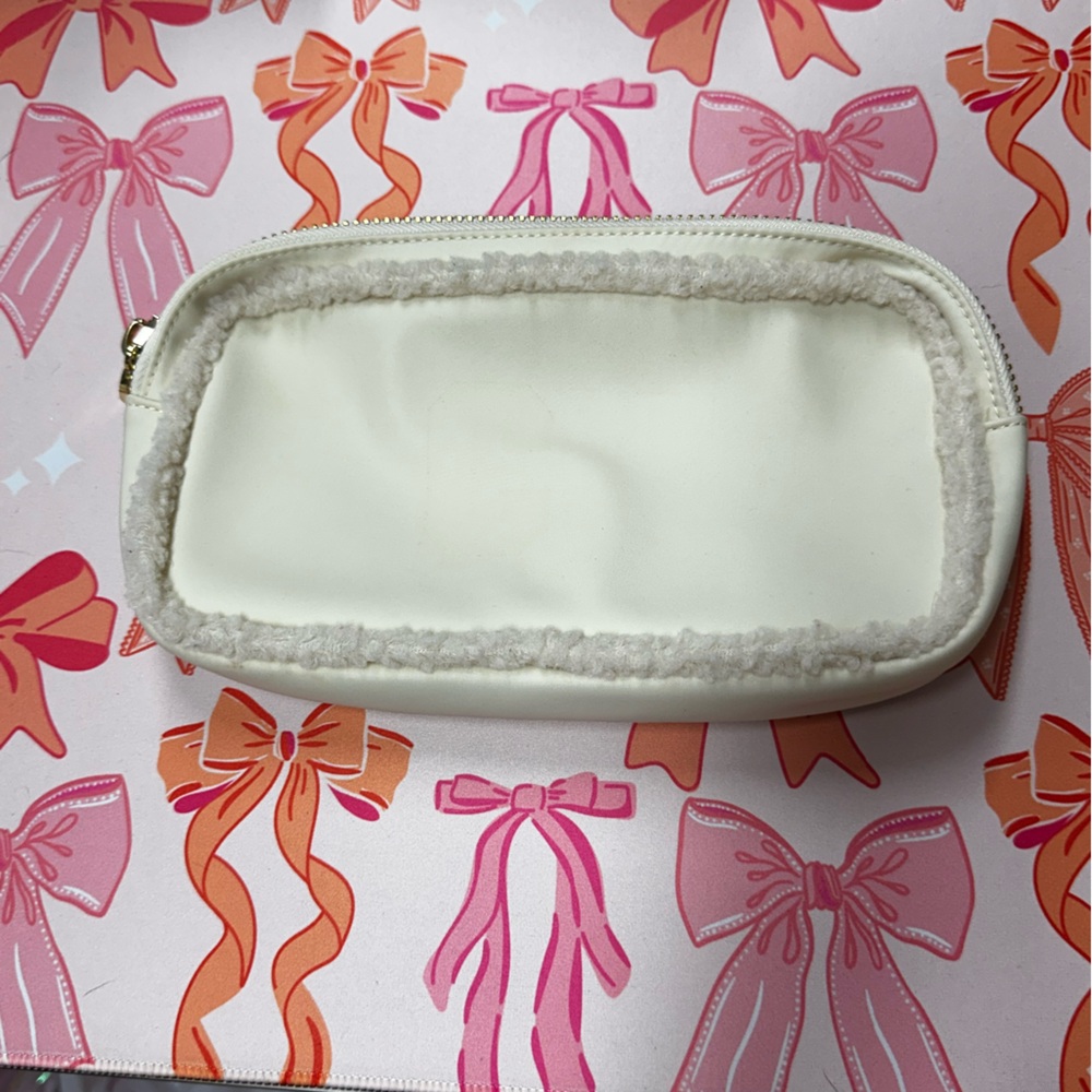 Cream SCL Small Pouch. Used condition…residue from patches